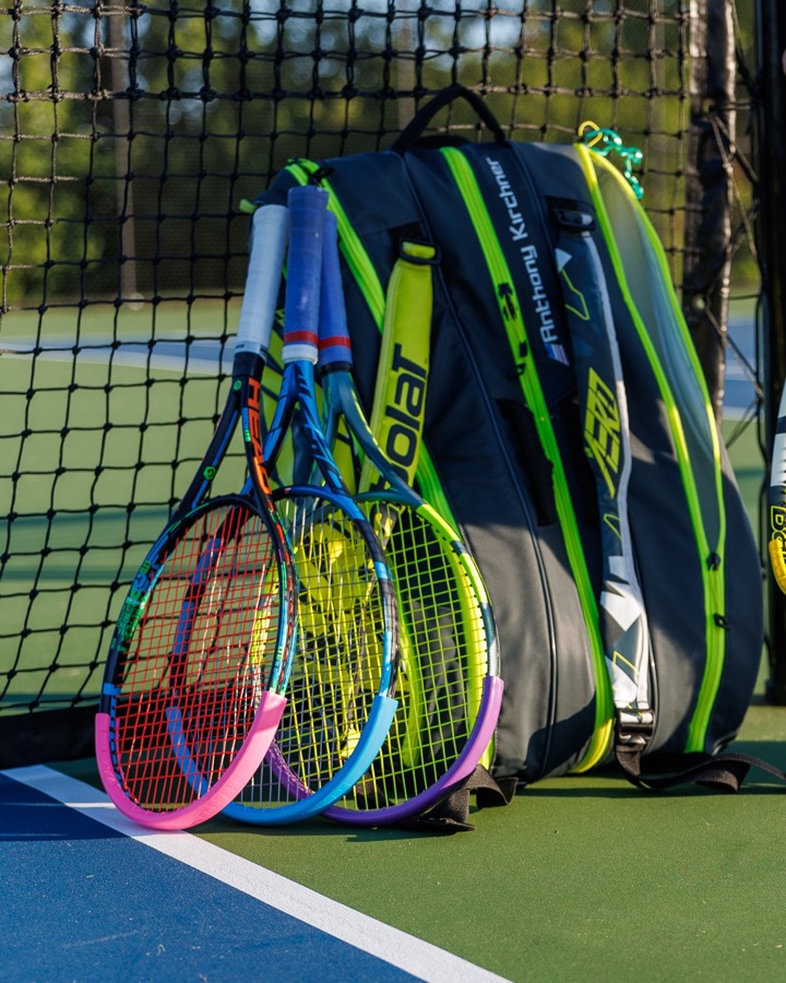 Several rackets, each with a Racket Guard fitted